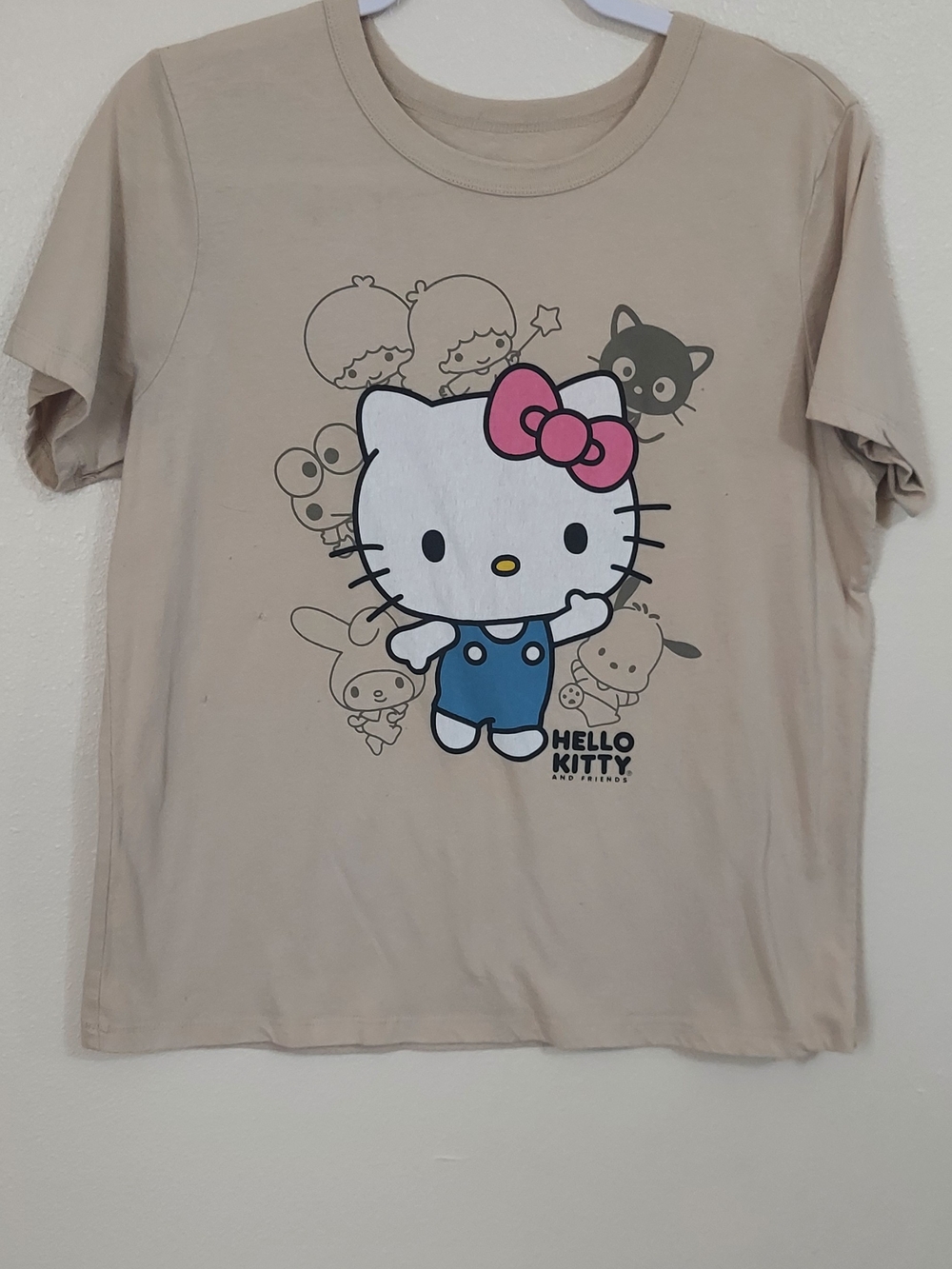 A.P.C. Hello Kitty Beige Tee with Pink Bow and Blue Outfit